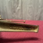 A collection of old shop shelf brackets.