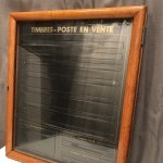 Post office stamp wall display case.