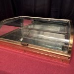Small antique shop counter display case.