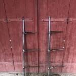 Pair of antique store shelf uprights.