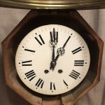 Antique wall clock from a shop or brasserie.