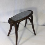 Old shoeshine or shoemaker's stool.