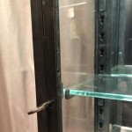 Pair of antique shop wall display cases.