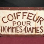 Old street sign. Hairdresser.